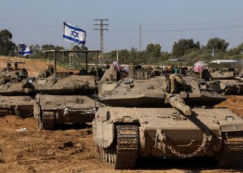 Israeli troops enter Gaza from the north and south, compelling Palestinians to evacuate their camps.