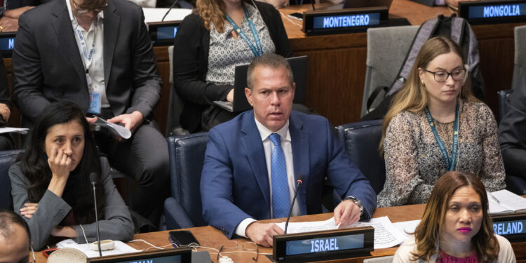 Israel condemns the United Nations resolution endorsing the rights of Palestinians and tears apart a duplicate of the charter.