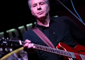 Blinken rocks out with Ukrainian band in underground venue, performing ‘Rockin’ in the Free World’ on guitar.