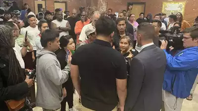 A 13-year-old was shot by a US police officer while on the ground, as he was carrying a replica handgun.