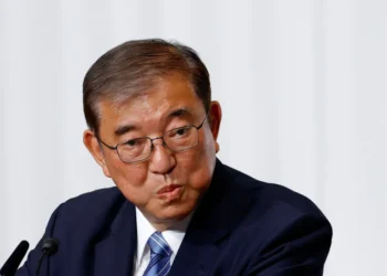 Japan’s Prime Minister Ishiba announced that he will remain in office despite facing challenges in the recent election.