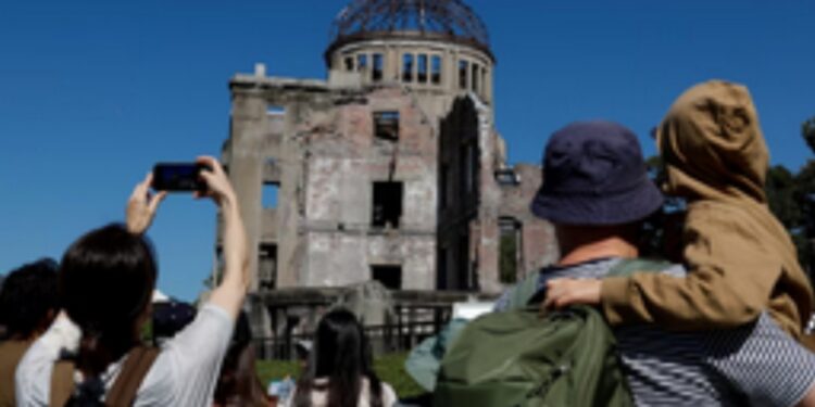 In Hiroshima Peace Park, attendees are optimistic that a Nobel Prize victory will enhance peace initiatives.