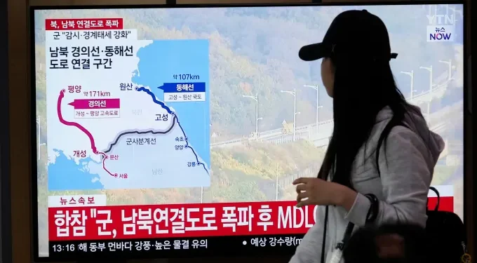 North Korea detonates roads close to the border with South Korea following a warning to sever all connections.